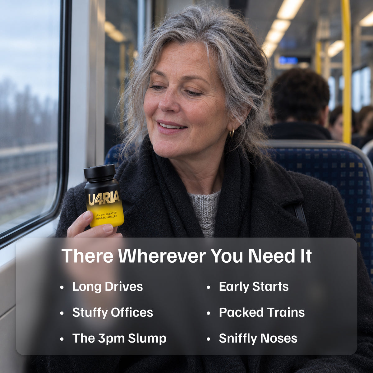 A smiling woman on a train holding a Lemon U4RIA inhaler, for long drives, early starts and stuffy offices