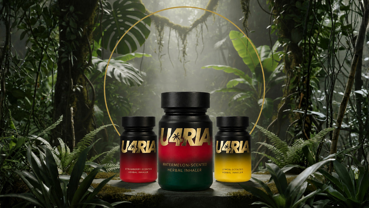 Watermelon-scented U4RIA herbal inhaler next to Lemon and Strawberry inhalers in the jungle.