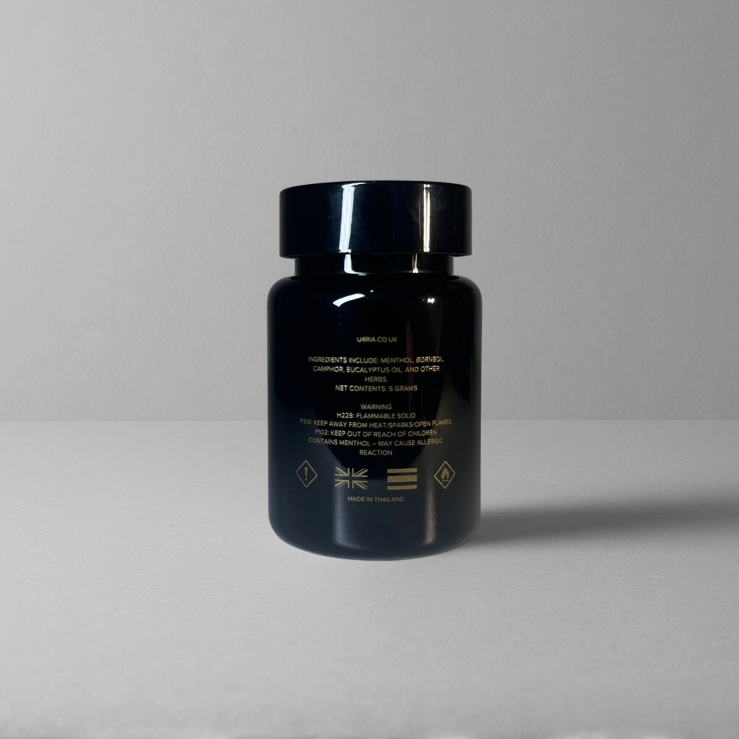 The back of a glossy U4RIA Bottle on plain grey background